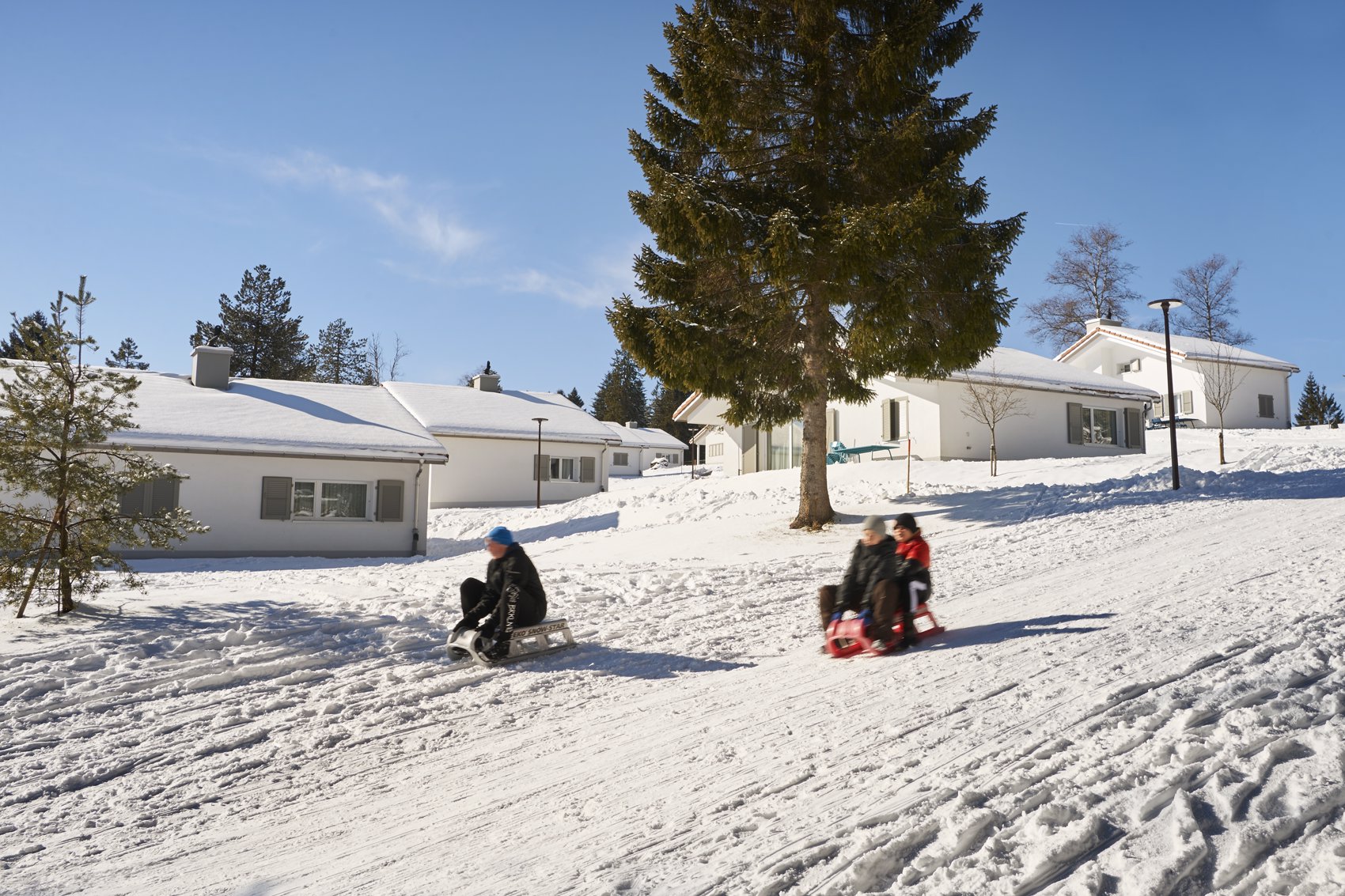 Exterior view in winter - Reka Holiday Village Montfaucon reka-holiday-village, western-switzerland, montfaucon Exterior view in winter - Reka Holiday Village Montfaucon reka-holiday-village, western-switzerland, montfaucon