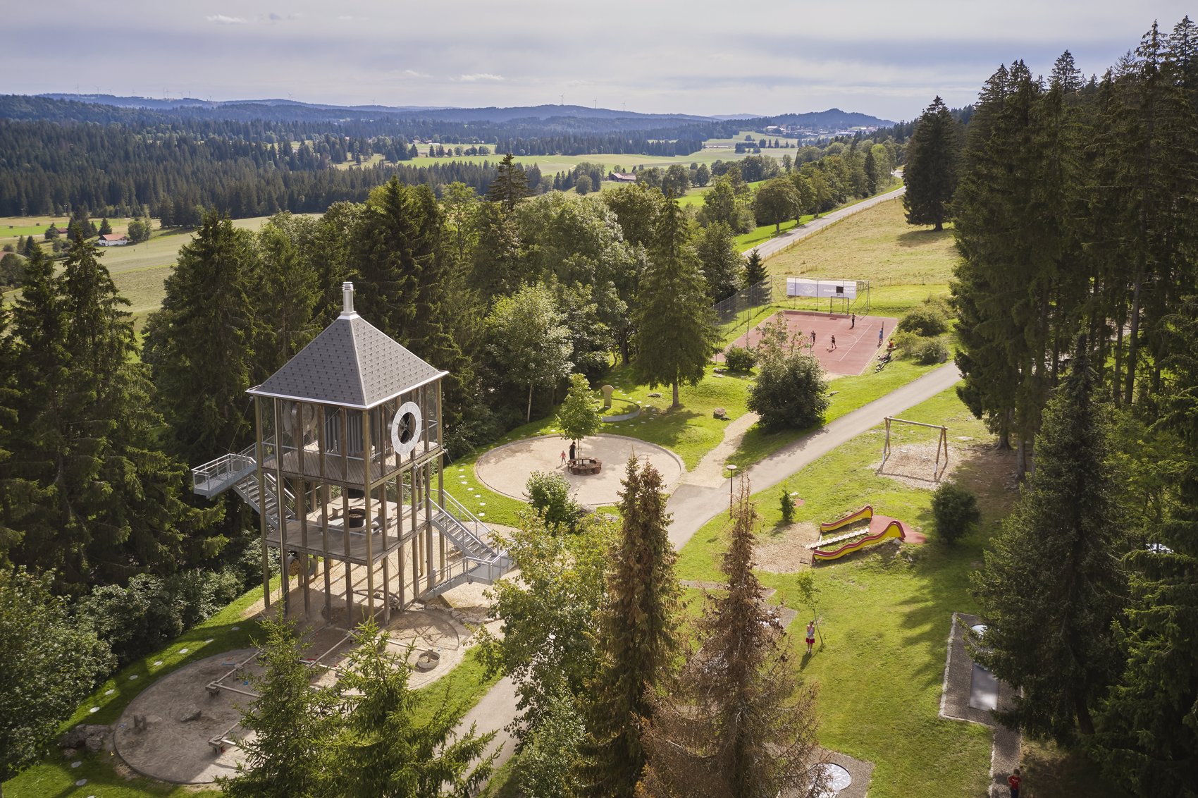 Exterior view in summer - Reka Holiday Village Montfaucon montfaucon, reka-holiday-village, western-switzerland Exterior view in summer - Reka Holiday Village Montfaucon montfaucon, reka-holiday-village, western-switzerland